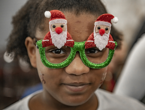 9-year-old Serenity Davis wore her Santa glasses for her visit with Santa Claus during Breakfast With Santa, held Saturday, December 21, 2024 at the San Gabriel Community Center.  The event, coordinated by the Georgetown Fire Department and the Rotary Club of Sun City, served up pancakes, sausage, juice and coffee too attendees.  Santa Claus was there throughout the morning to visit the kids and their families.    Photo by Andy Sharp.
