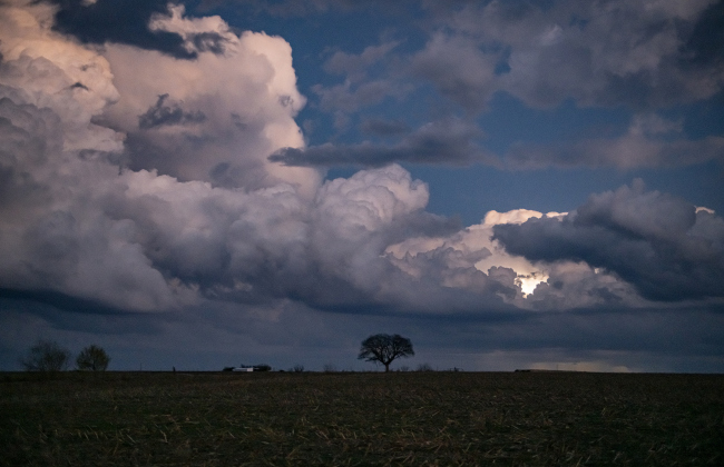 Clouds gather over a field along County Road 356 east of  Granger on a potentially stormy night, Tuesday, December 24, 2024.