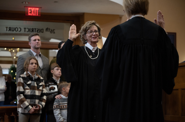 Betsy Lambeth is sworn in as District Judge for the 425th District Court by Judge Stacey Mathews, right, of the 277th District Court during induction ceremonies.