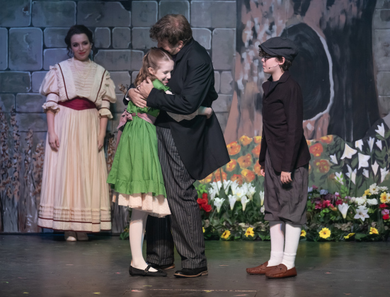 Mikaela Pace, back left, as Lily, Molly Jackson, as Mary Lennox, Damon Brown, as Archibald Craven, and William Reeves, right, playing Colin Craven, are pictured in a dress rehearsal photo from the Georgetown Palace production of “The Secret Garden” on  Thursday, January 30, 2025. The play runs on the Springer Stage through March 2.   Photo by Andy Sharp.