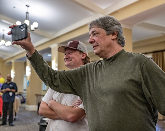 David Blaschke, right, joined by his son Jason, 27, takes photos of his father Al Blaschke.