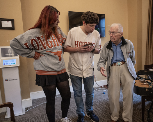 Al Blaschke, right, is joined by his grandson Kevin Blaschke, center, and Kevin’s wife Kylie Stewart, left, as he celebrates his 108th birthday with a party  at The Wesleyan Assisted Living on Saturday, January 4, 2025.