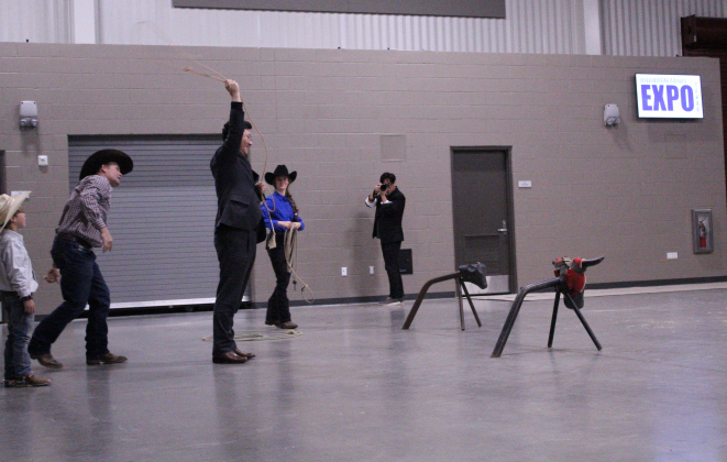 Mr. Lee gets ready to rope a steer. The demonstrations were performed by Claymen Rodeo students.