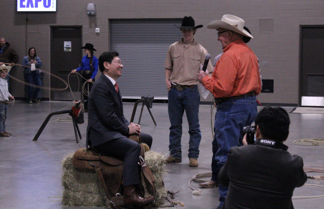 Mr. Lee is taught how to mount a saddle and says his “first yee-haw.”