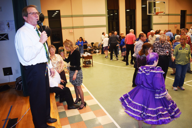 Honored caller Brad Caldwell leads Shirts ‘n’ Skirts dancers after his induction into the Texas State Callers Association Hall of Fame.