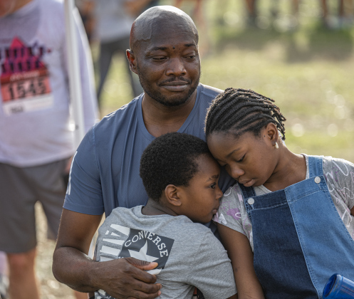 Murcellinus Ojinnaka spends quiet time with his children Adrian, 7, and Athena, 10, after he completed the 5K race during the 30th Annual Cupid’s Chase, held in San Gabriel Park on Saturday, February 8, 2025. The event is sponsored by the Georgetown Parks Department.   Photo by Andy Sharp.
