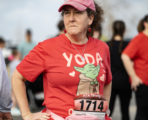 Judy Robbins, decked out in her Yoda t-shirt, was ready to run in the 5K race during the 30th Annual Cupid’s Chase, held in San Gabriel Park on Saturday, February 8, 2025. The event is sponsored by the Georgetown Parks Department.   Photo by Andy Sharp.