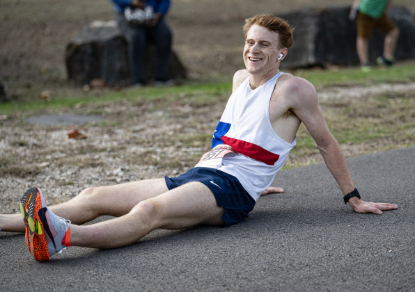 Chase Bennett, the overall 5-K race winner, relaxes at the end of his first-place finish during the 30th Annual Cupid’s Chase, held in San Gabriel Park on Saturday, February 8, 2025. The event is sponsored by the Georgetown Parks Department.   Photo by Andy Sharp.