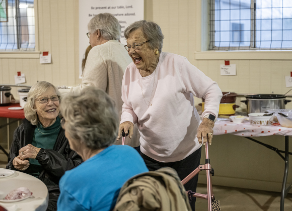 Ethel Mickan, standing, visits with Fayrene Tonn, seated at left, and Mary Schubert, right, during the 9th Annual Free Soup Supper, held at St. Peter Lutheran Church  on Monday, February 10, 2025.