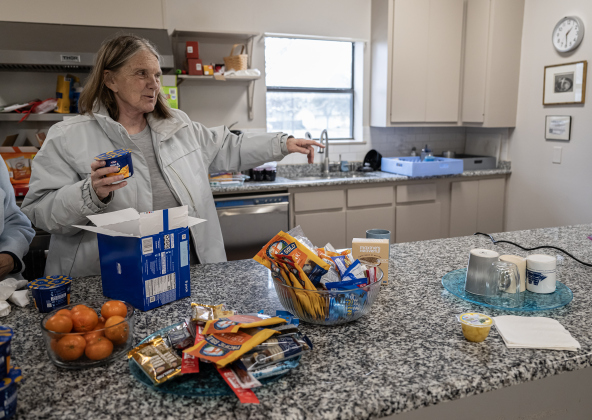 Church pastor Terry Pierce helps out in the warming center at St. James Episcopal Church on Wednesday, February 19, 2025.