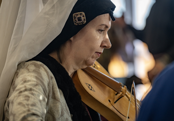 Stephanie Stuart, whose society name is Isabeau D’Arc, plays an instrument from the 1100s called a vielle, a predecessor to the modern viola at the Society for Creative Anachronism Bryn Gwald Candlemas, held Saturday, February 1, 2025.