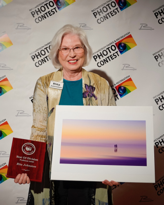 Rita Johnston stands with "Infinity View” and won a plaque in the Proficient Division.