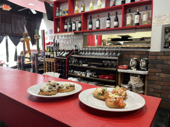 Bruschetta Originale and Bruschetta con Funghi on top of the wine bar at Milano Trattoria.