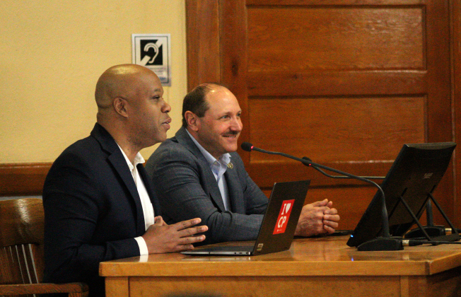 Chief Economic Development Officer for the City of Cedar Park Arthur Jackson, front, and Chief Operating Officer of Firefly Aerospace Dan Fermon, back, explain the economic impact of a spaceport during the meeting. Photo by Nalani Nuylan.