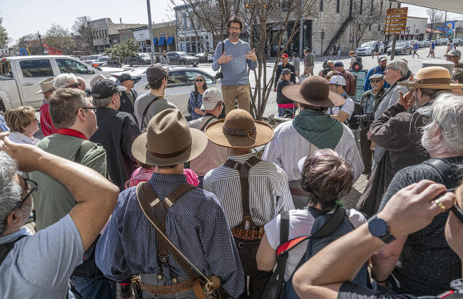 Architecture photographer Nikola Olic, pictured at center outside the Williamson Museum,  led a photo walk around downtown Georgetown during the Texas Photography Festival on Saturday, March 15, 2025.
