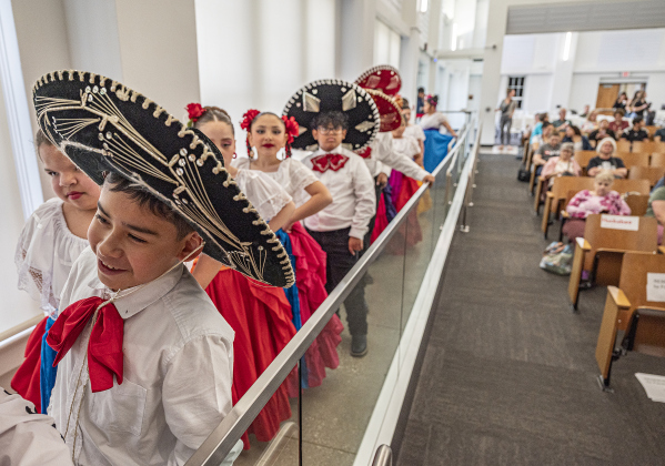 Williams Elementary 3rd grader Miguel Santos (front), a member of the Georgetown ISD Ballet Folklorico Company (comprised of several district schools)  prepares to go onstage with fellow dancers during the district’s State of the District event, held at district headquarters on Thursday, March 13, 2025.   Photo by Andy Sharp
