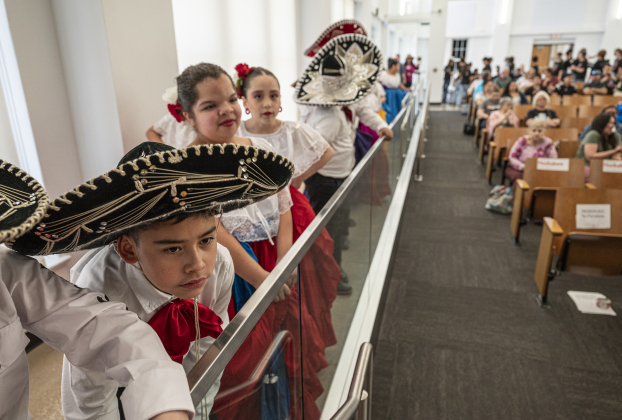 Williams Elementary School 3rd grader Miguel Santos (front) prepares to perform with fellow members of the Georgetown ISD Ballet Folklorico Company (comprised of several schools) during the district’s State of the District event, held at district headquarters on Thursday, March 13, 2025.   Photo by Andy Sharp.