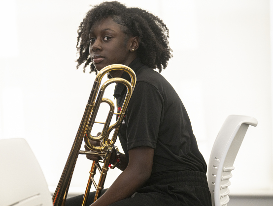 Tippet Middle School 7th grader Delinda Fletcher, a member of her school’s Honors Band, prepares to take the stage.