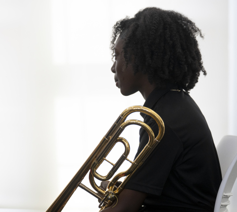 Tippet Middle School 7th grader Delinda Fletcher, a member of her school’s Honors Band, prepares to take the stage.