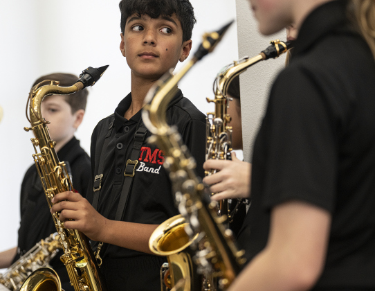 Tippet Middle School tenor saxophonist Amir Poursmaeili, a member of his school Honors Band, prepares to perform.