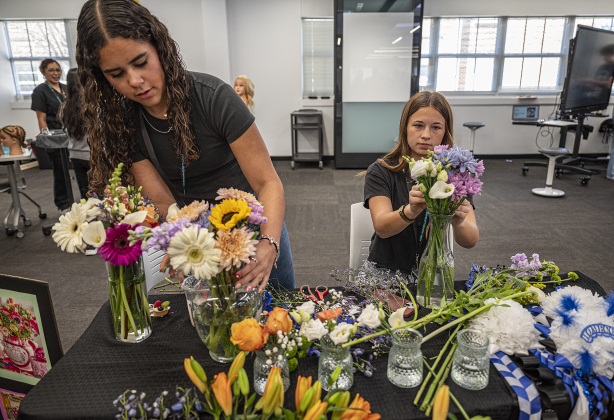 Georgetown High School Floral Design students Caitlin Clements, left, and Emie Benson, right, both 11th graders, demonstrate their skills during the Georgetown I.S.D. State of the District event, held at district headquarters on Thursday, March 13, 2025.   Photo by Andy Sharp.