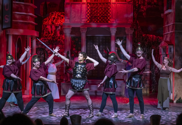 Ryan Rhue (with sword), as Miles Gloriosus, is pictured with cast members in a Thursday, March 20, 2025 dress rehearsal of “A Funny Thing Happened On the Way to the Forum,” playing on the Palace main stage through April 19th.    Photo by Andy Sharp.