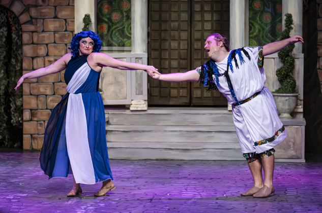 Jill Schneider, as Gymnasia, and Nathan Clemenson, as Prologus, are pictured in a Thursday, March 20, 2025 dress rehearsal of “A Funny Thing Happened On the Way to the Forum,” playing on the Palace main stage through April 19th.    Photo by Andy Sharp.