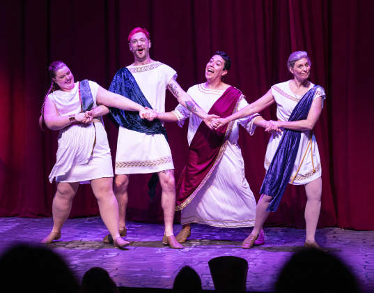 Pictured left to right, each  in the role of Protean, are Brooke McGaughey, Matthew Hubble, Nick Riley and Meredith Brand, all seen  in a Thursday, March 20, 2025 dress rehearsal of “A Funny Thing Happened On the Way to the Forum,” playing on the Palace main stage through April 19th.    Photo by Andy Sharp.