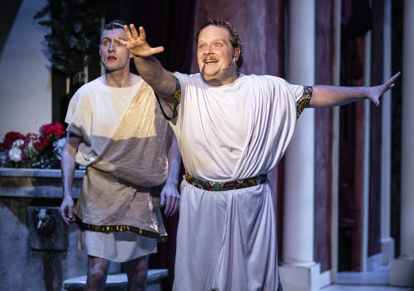 Nathan Clemenson, front right, as Prologus, and Dawson MacLeod, playing Hero,  are pictured in a Thursday, March 20, 2025 dress rehearsal of “A Funny Thing Happened On the Way to the Forum,” playing on the Palace main stage through April 19th.    Photo by Andy Sharp.