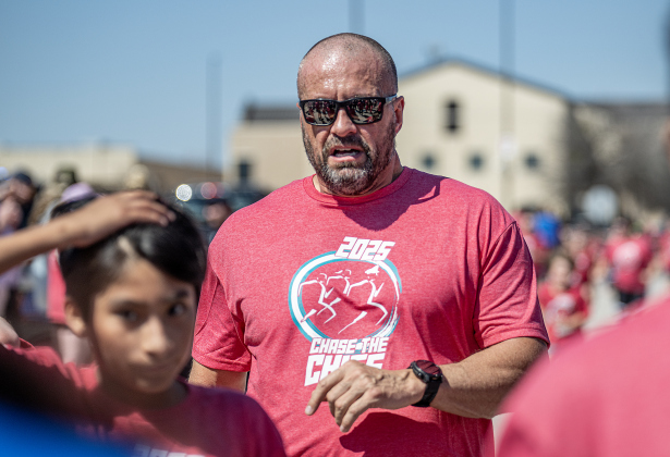 Georgetown Police Chief Cory Tchida participates in the one-mile Fun Run during the 13th Annual Chase the Chief, held Sunday, March 2, 2025 at East View High School.   2,000 people were registered for the one-mile fun run and 5K event.   Proceeds from the races support physical education programs in Georgetown.   Photo by Andy Sharp.