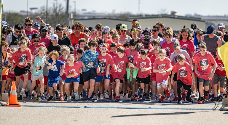 Runners leave the starting line for the 5-K race  during the 13th Annual Chase the Chief, held Sunday, March 2, 2025 at East View High School.   2,000 people were registered for the one-mile fun run and 5K event.   Proceeds from the races support physical education programs in Georgetown.   Photo by Andy Sharp.