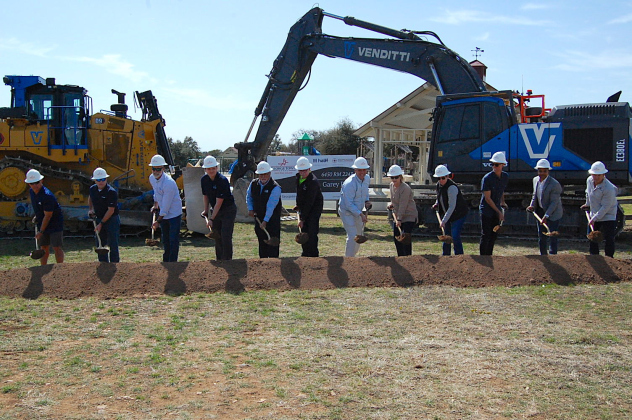 City Manager David Morgan, center, with Parks and Recreation Director Kimberly Garrett, right, and staff members from consulting firm Halff and construction company STR break ground at Garey Park on March 6. (Photo by Kaitlyn Wilkes)