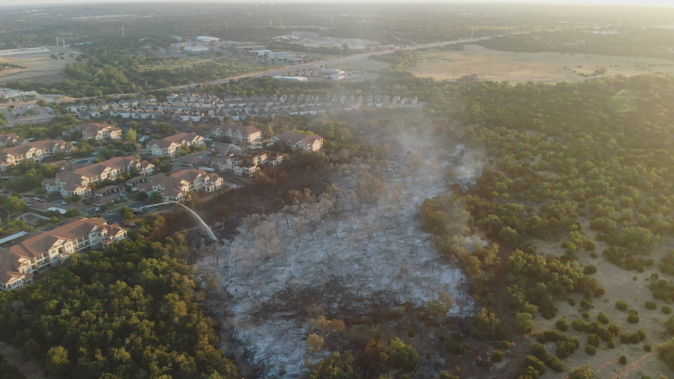 50 acres burnt near Parmer Lane: an overview shot shows an area in Cedar Park impacted by the Parmer Lane fire in August 2023. [Sun archive photo]
