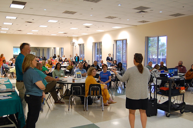 Cat Phelps, right, representing Georgetown’s Rotary Club, speaks to attendees about the need for additional nonprofits partners to contribute toward the September 11 Day of Service. (Photo by Kaitlyn Wilkes)