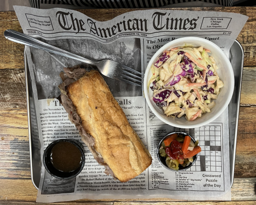 An Italian beef sandwich entree with a side of wicked slaw.