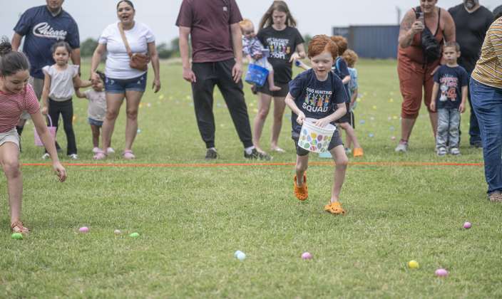 8-year-old Aiden Pogue, front right, dashes for eggs during the annual Easter Egg Hunt conducted by Georgetown Church of the Nazarene  on Saturday,  April 19, 2025.  5,000 Easter Eggs found new homes in just a few minutes' time.