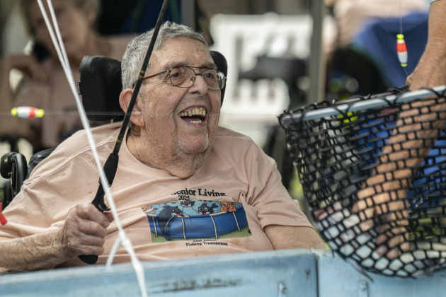 Joe Vrabel, 89, smiles as looks into a net at a fish he caught  during the 22nd Annual Fishing Tournament held at Taylor’s SPJST Senior Living  on Thursday, April 24.