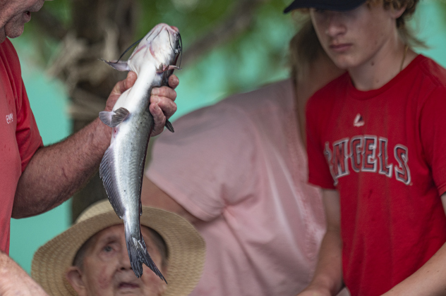 5-year-old Paula Park reacts to one of the eight fish she caught during the 22nd Annual Fishing Tournament held at Taylor’s SPJST Senior Living  on Thursday, April 24.
