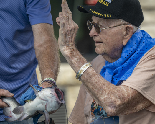 97-year-old Calvin Ging gives a thumbs up to a fish he caught during the 22nd Annual Fishing Tournament held at Taylor’s SPJST Senior Living  on Thursday, April 24.