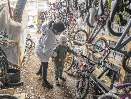 Monica Garza and her son Elijah, 4, enjoyed their time at Georgetown Free Bikes during the Grand Opening celebration of the nonprofit's new home on Saturday, April 5, 2025.  Their new address is 2055 F.M. 1460 in Georgetown.  Georgetown Free Bikes makes bicycles available to anyone who wants one at no charge.  