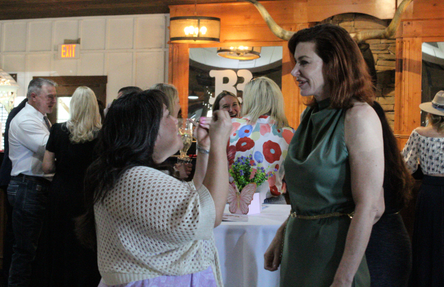 Yesterday’s Gone Life Coach Yoko Ochoa, left, expresses her excitement about the nonprofit’s first fundraiser to founder and executive director Loree Tamayo, May 3. 