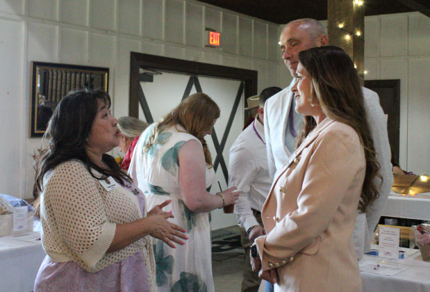 Yesterday’s Gone Life Coach Yoko Ochoa, left, converses with Angela Williams, Williamson County Justice of the Peace for Precinct Two, right, at the “Resilience to Radiance” Fundraising event at Reunion Ranch.