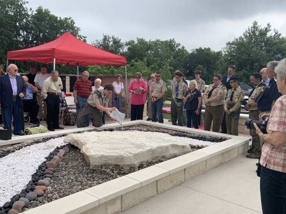 Scout Trevor Suggs spreads remains in the new scatter garden.