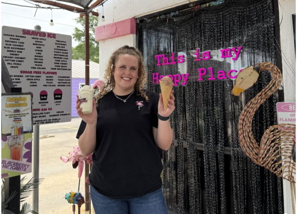 Faith Thomas, the owner of Frozen Flamingo, holding frozen treats. Photo by Abbey Archer