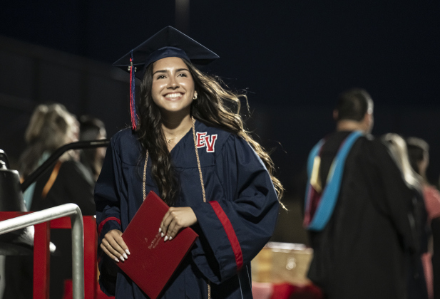 Emma Corley crosses the stage during commencement for East View High School at the Georgetown ISD Athletic Complex on Friday, May 23, 2025.  489 East View seniors received their diplomas.    Photo by Andy Sharp.