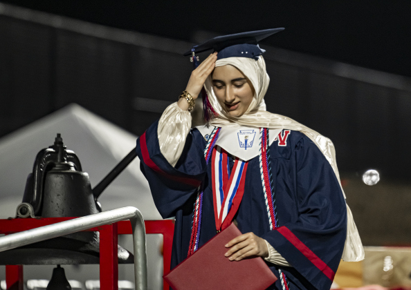 Sana Rahim, a National Honor Society member, leaves the stage after receiving her diploma during commencement for East View High School at the Georgetown ISD Athletic Complex on Friday, May 23, 2025.  489 East View seniors received their diplomas.    Photo by Andy Sharp.