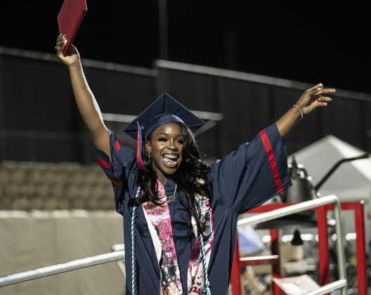 Kamyah Smith celebrates  during commencement for East View High School at the Georgetown ISD Athletic Complex on Friday, May 23, 2025.  489 East View seniors received their diplomas.    Photo by Andy Sharp.
