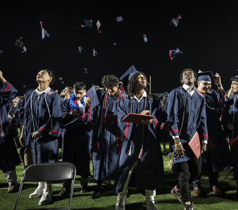 Graduates throw their mortarboards into the air at the conclusion of  commencement for East View High School at the Georgetown ISD Athletic Complex on Friday, May 23, 2025.  489 East View seniors received their diplomas.    Photo by Andy Sharp.