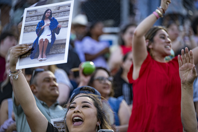 Angeline Harrison holds a photo of her sister, East View graduating senior Abreanna Ortega during commencement for East View High School at the Georgetown ISD Athletic Complex on Friday, May 23, 2025.  489 East View seniors received their diplomas.    Photo by Andy Sharp.
