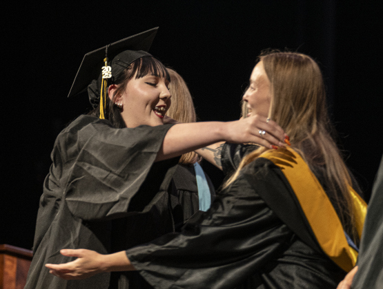 Kendra Lynn Zuniga is congratulated by Crystal Bandeira  during the Richarte High School commencement ceremony held at the Klett Performing Arts Center  on Thursday, May 22, 2025.